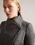 ROSEANE-Outerwear-Wrap yourself in elegance and warmth with the exquisite ROSEANE. Made from 100% wool with a herringbone texture, this coat exudes timeless style. Metal edge details refine the look for everyday wear. Wrap coat 100% wool Belted waist Button fastening Metal hardware tipping Pockets Herringbone texture Midi length- Ted Baker Romania